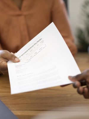 man-holding-contract-his-new-office-job-after-interview